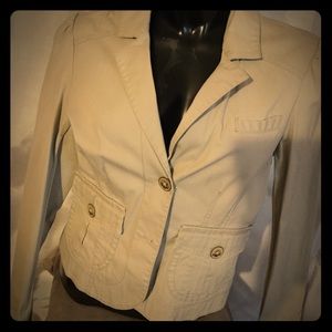 Tan long sleeve button down jacket.